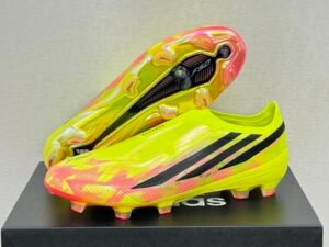 141 Adidas F50 Hyperfast Elite Laceless "Too Light" Pack. Team Solar Yellow, Core Black, and Solar Turbo (pink/orange) colorway.